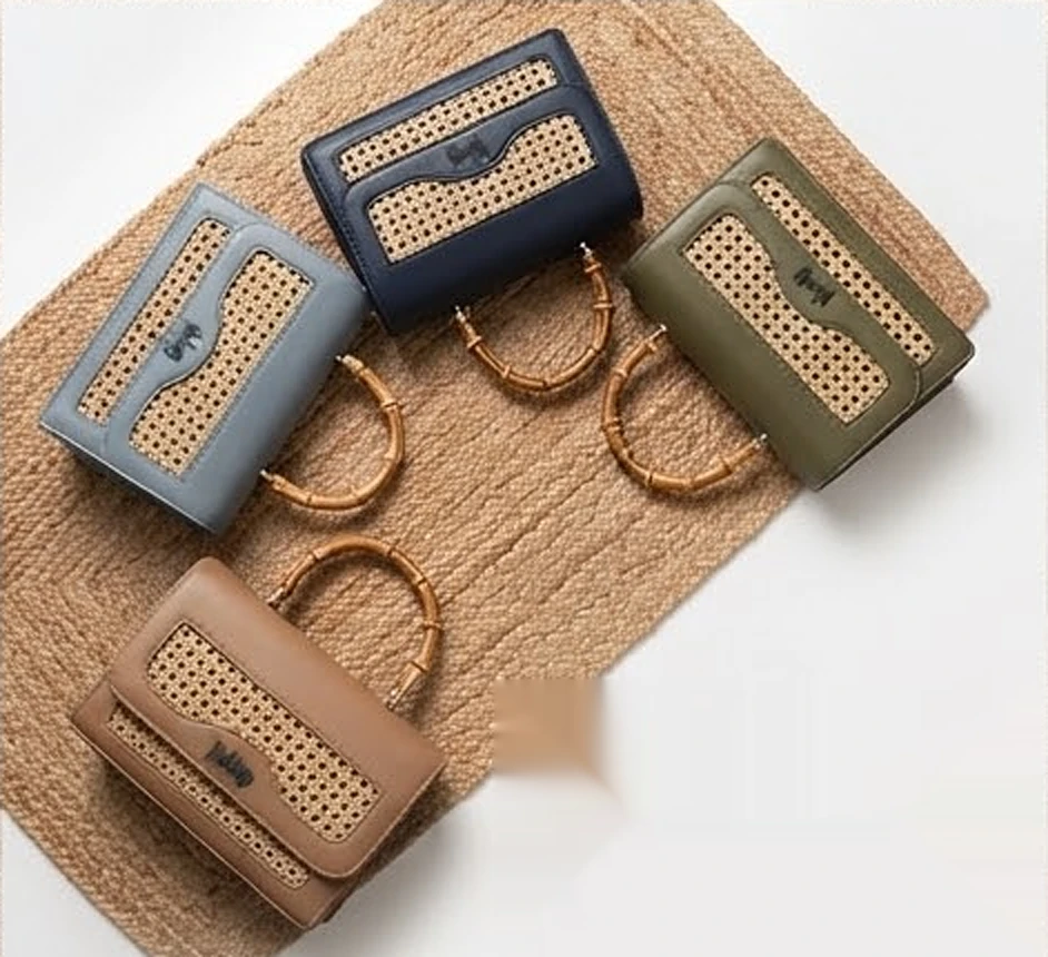Malang bags in blue, navy, olive and tan on a jute rug
